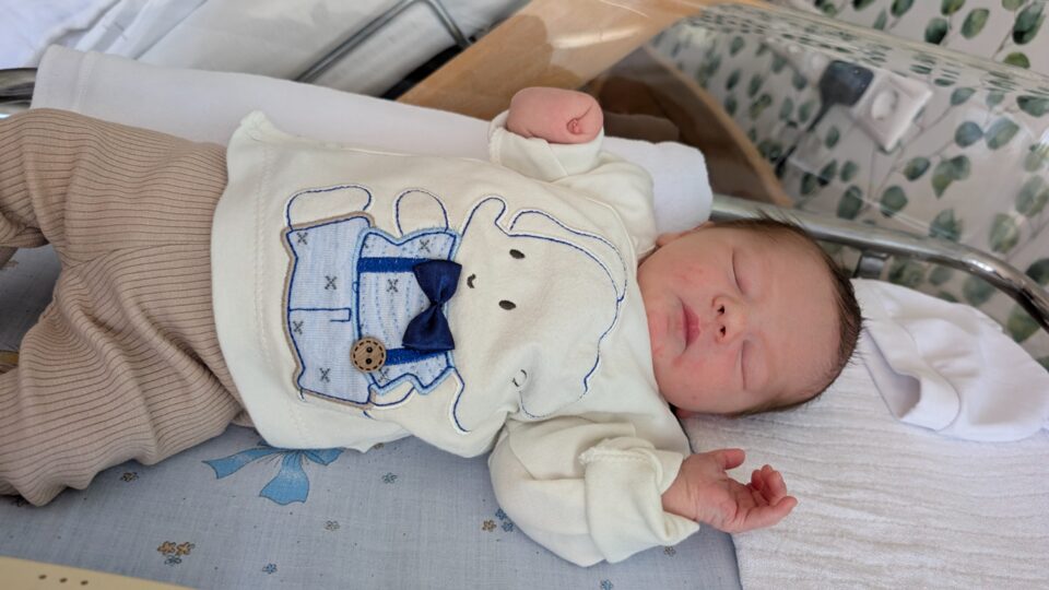 Olivér asleep, his left arm tucked across his chest